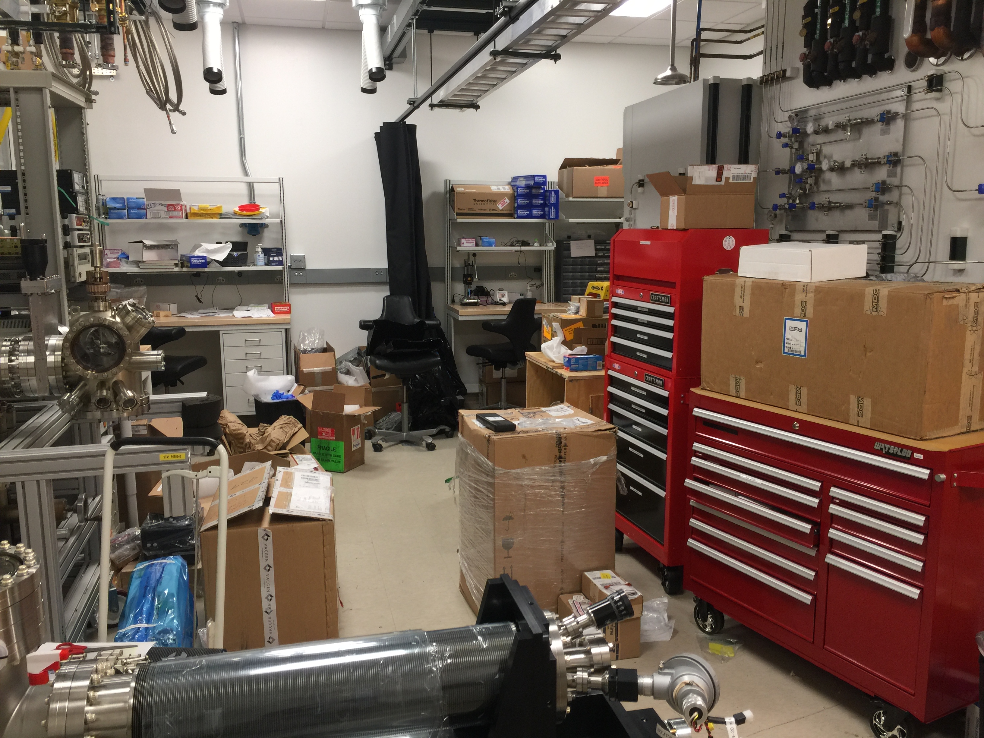 The new lab space is under construction, with the infrastructure of the room (gas sources, power, exhuast, etc.) all recently completed.  Now the two vacuum chambers for this room are undergoing installation -- which requires unpacking a lot of boxes!